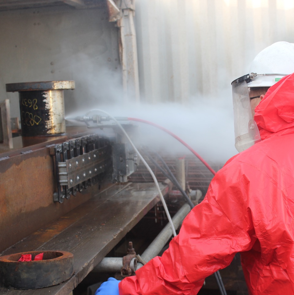 Operative overseeing cold cutting process with full protective equipment